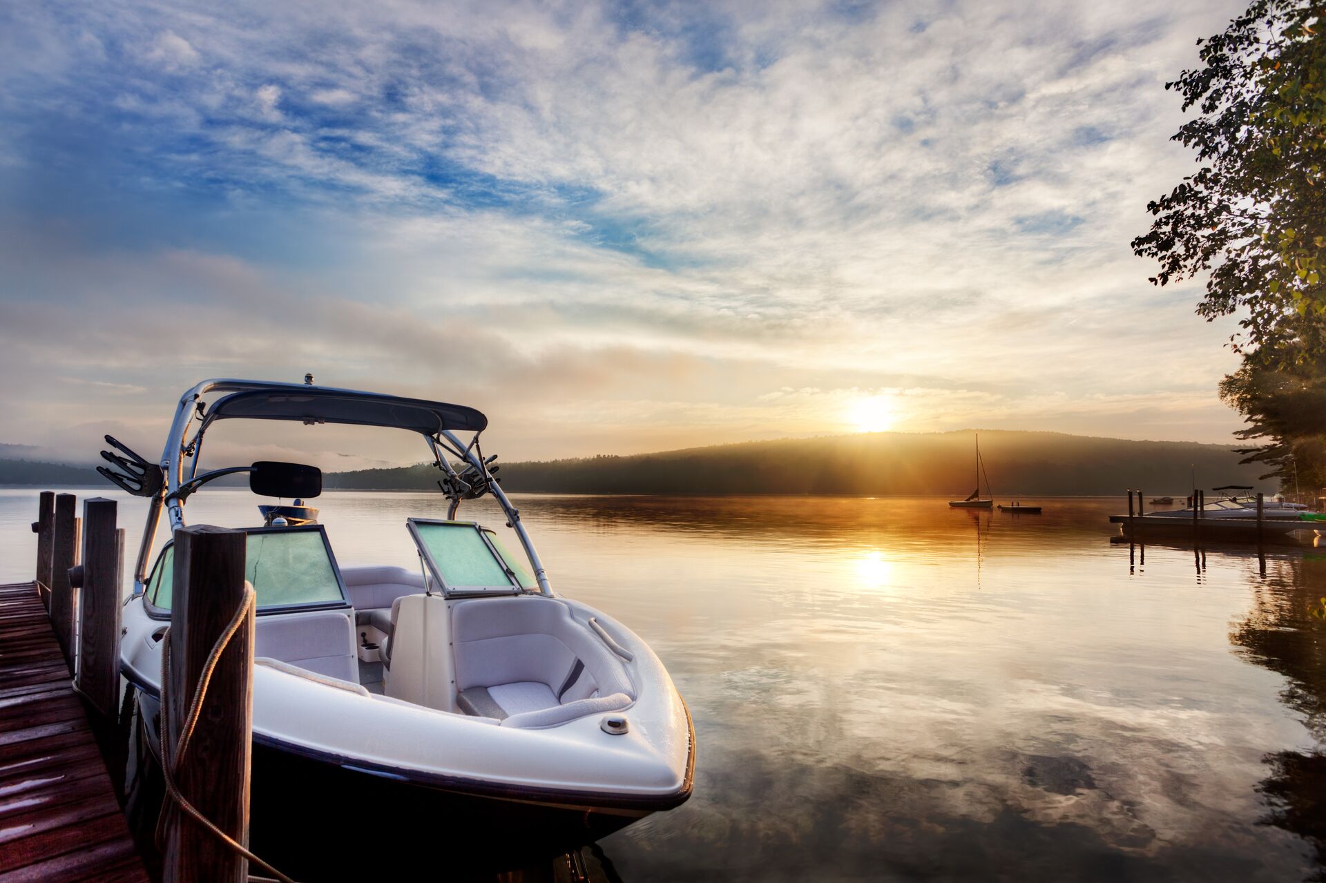 A boat at the dock at sunset, buy a boat concept. 