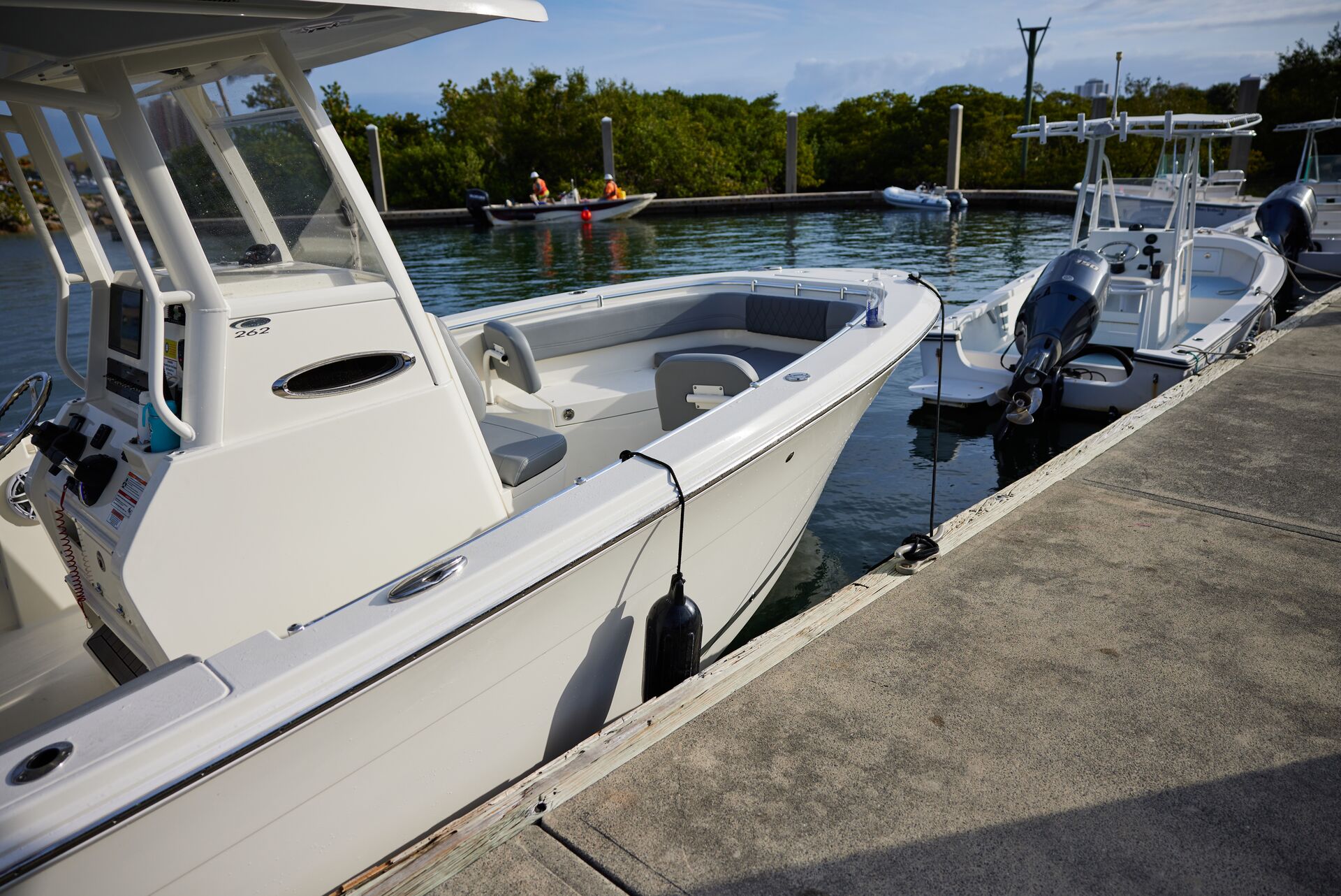 Two boats tied at the dock, buy a boat concept. 