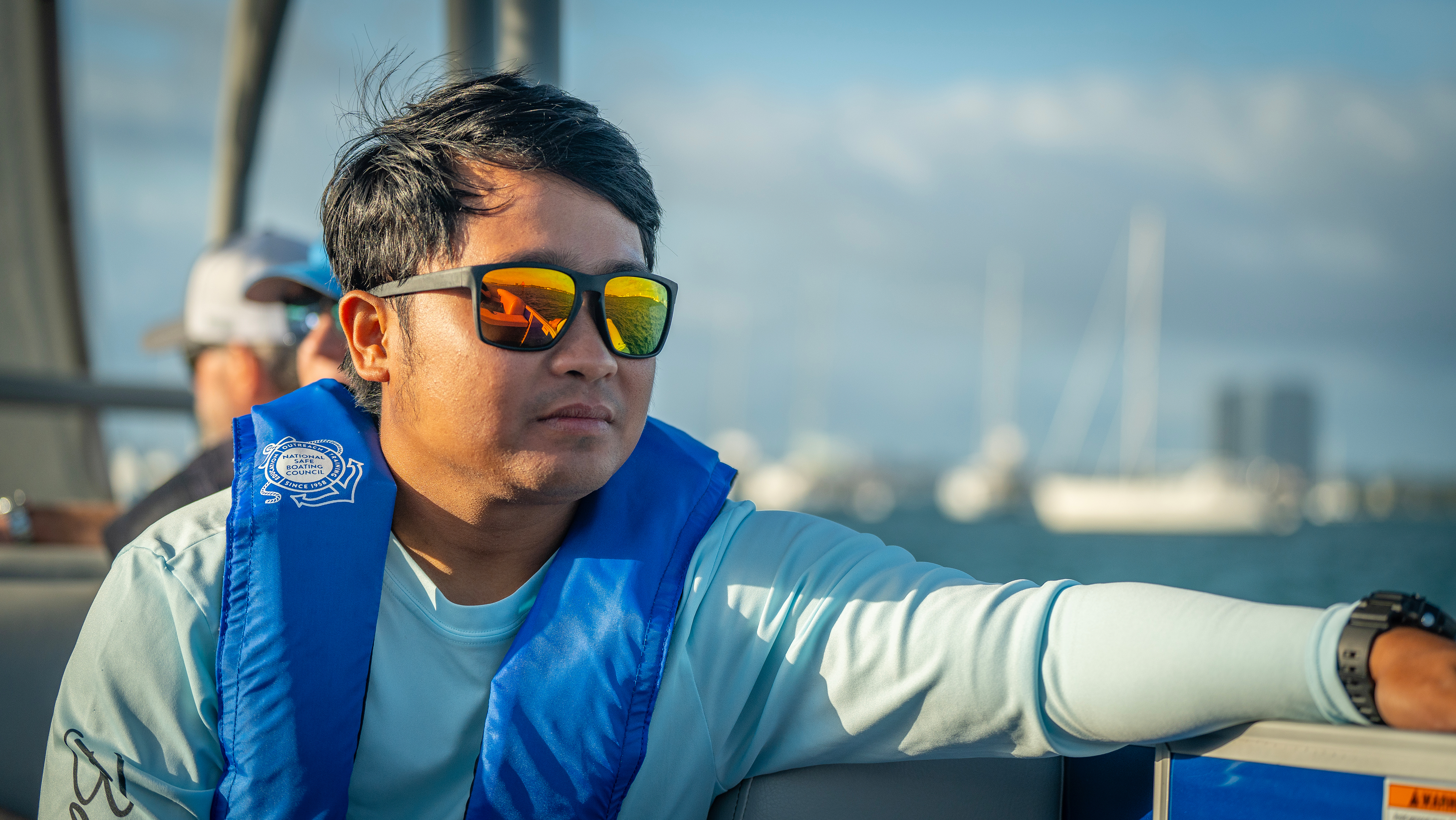 A man wearing a life jacket on a boat, Type 3 life jackets concept. 